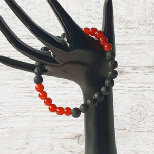 This orange-red Carnelian and black Lava stone stretch bracelet is suitable for people who have a metal allergy.