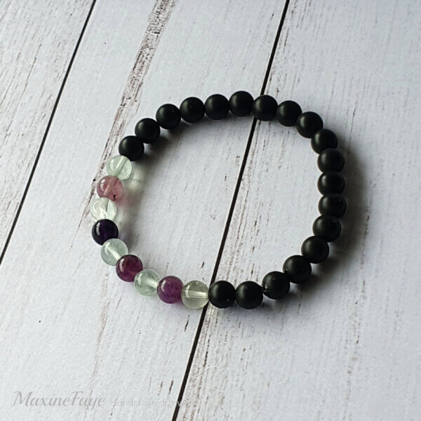 This Black Onyx and Rainbow Fluorite gemstone stretch bracelet is suitable for people who have a metal allergy.