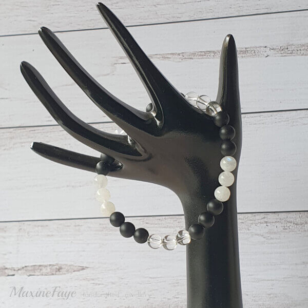 This Moonstone, Clear Quartz Crystal & Matte Black Onyx gemstone stretch bracelet is suitable for people who have a metal allergy.