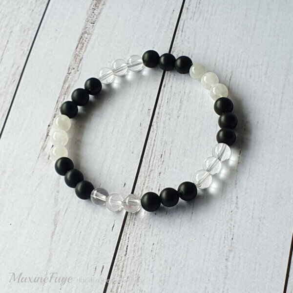 This Moonstone, Clear Quartz Crystal & Matte Black Onyx gemstone stretch bracelet is suitable for people who have a metal allergy.