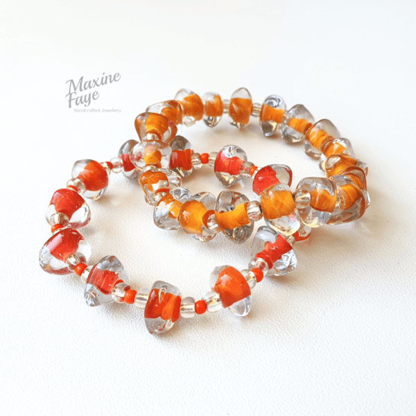 Stretch bracelets in Mandarin and Tangerine shades of orange.